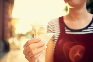 pretty woman outdoors eating ice cream walk photo