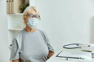 elderly woman wearing medical mask hospital treatment health care photo