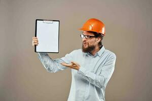 Worker man orange hard hat construction industry manual photo