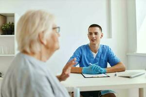 elderly woman patient is examined by a doctor health care photo