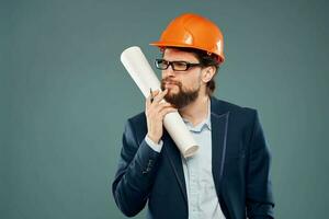 engineer in orange helmets with blueprints in hands construction industry lifestyle photo