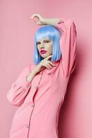 portrait of a woman in blue wig pink dress red lips Lifestyle posing photo