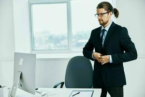 The man in a suit with glasses self-confidence work boss photo