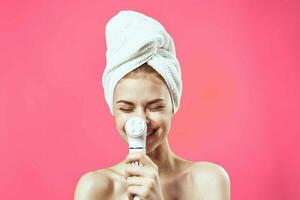 woman with towel on head cleaning skin therapy close-up photo