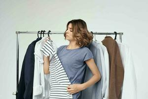 beautiful woman clothes hanger shopping isolated background photo