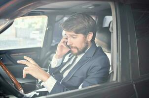 emotional man Driving a car trip luxury lifestyle success service rich photo