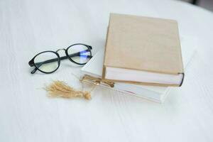 Book and eyeglasses photo
