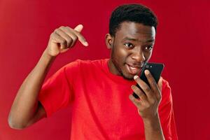 African guy talking on a cell phone and gesturing with his hands photo
