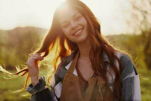 Woman smiling in the background of sunset sunlight in nature photo