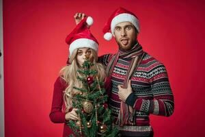 man and woman in New Year's clothes celebrate Christmas together photo