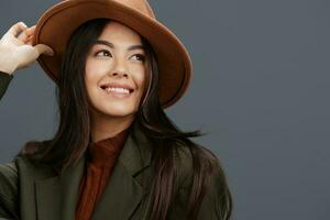 woman in a stylish suit beige hat posing Lifestyle photo
