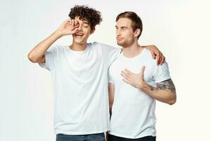 two men are standing next to clean t-shirts emotions photo