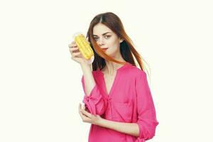 woman eating eclair Glamor snack close-up light background photo