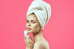 woman with towel on head naked shoulders massage medicine cosmetics photo