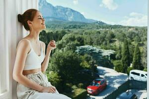 portrait of a young woman comfortable hotel luxurious green nature view Summer day photo