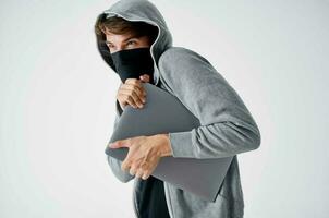 hacker hooded head hacking technology security light background photo