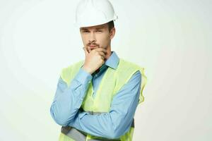 man in construction uniform blueprints builder isolated background photo