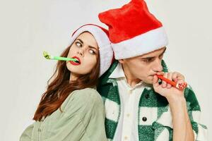 young couple festive pipes fun fashion christmas eve photo