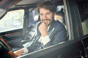 emotional man in a suit in a car a trip to work service photo