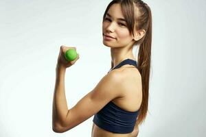 sports woman holding green dumbbells fitness motivation photo