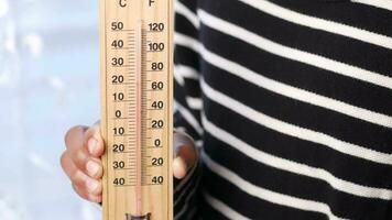 Close up of a man hand holding Temperature measurement video