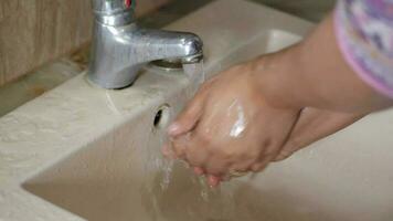 washing hand with hot water video