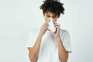 man in white t-shirt handkerchief cold treatment photo