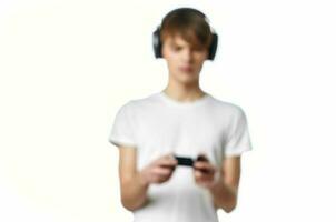 guy in white t-shirt with headphones playing video games photo