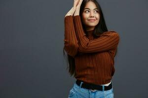 portrait woman hand gestures brown sweater fashion isolated background photo