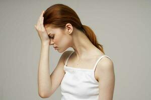 woman headache health problems stress light background photo