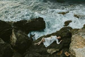 Beautiful bride in white wedding dress on sea shore wet hair vacation concept photo