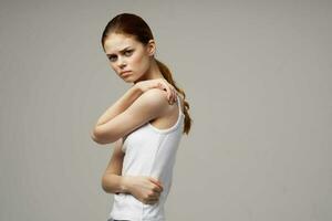 disgruntled woman pain in the neck arthritis chronic disease studio treatment photo