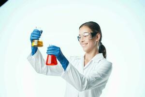 Female laboratory assistant in a white coat chemical solution Professional photo