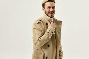 man fashionable hairstyle beige coat fashion modern style photo