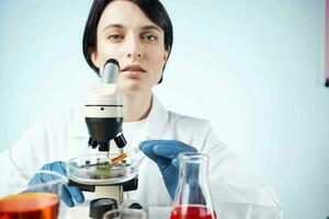 woman laboratory assistant microscope research diagnostics science work photo