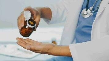 Close-up view of female doctor hands filling patient registration form. Healthcare and medical concept video