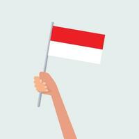 Vector illustration hands holding Indonesia flags on white background