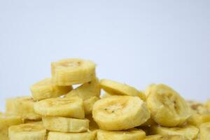 Close up slice yellow banana isolated on white background photo