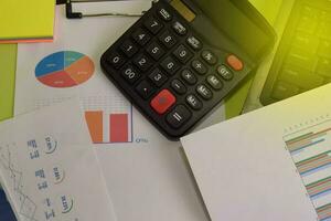 Calculator budget cost and analysis financial and paperwork. Business and finance concept of office desk photo