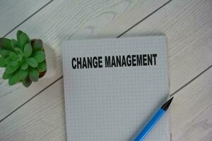 The book of Change Management isolated on Wooden Table. photo