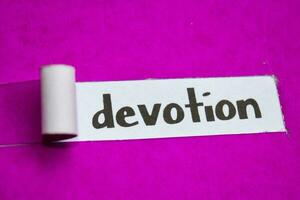 Devotion text, Inspiration, Motivation and business concept on purple torn paper photo