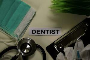 Dentist with inspiration and healthcare medical concept on desk background photo