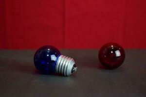 Close up lamp in red background and black table photo