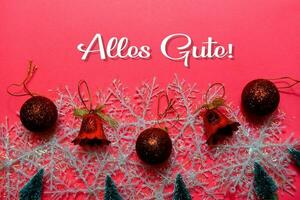 Alles Gute text isolated on Pink backgroud. It means Best Wishes. Frame of Christmas Decoration. photo