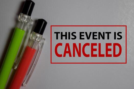 This Event is Canceled write on a book isolated on Office Desk. photo