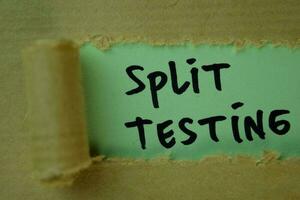 Split Testing Text written in torn paper photo
