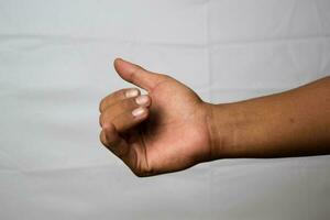 Close up Asian man shows hand gestures it means Let's Go isolated on white background photo