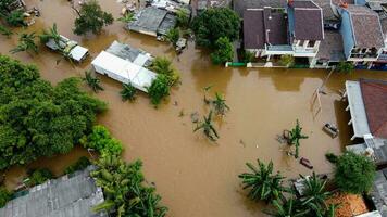 Aerial POV view Depiction of flooding. devastation wrought after massive natural disasters at Bekasi - Indonesia photo