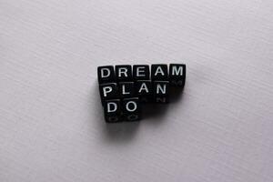Dream. Plan. Do on wooden blocks. Motivation and inspiration concept photo