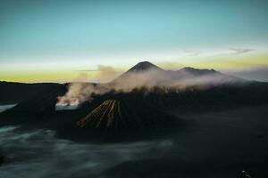 Beautiful colorful sunrise over Mount Bromo and wild island in Mount Bromo National Park photo